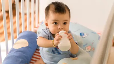 Baby with a milk bottle